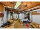 Unfinished basement with exposed ceiling, boxes, and some storage items at 207 Crossing Ave, Belmont, NC 28012