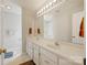 Bathroom featuring double sinks, a large mirror, and ample counter space at 207 Crossing Ave, Belmont, NC 28012