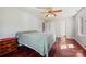 Spacious bedroom with hardwood floors, ceiling fan, and neutral paint at 207 Crossing Ave, Belmont, NC 28012