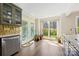 Bright kitchen nook with doors to the yard with plenty of natural light at 207 Crossing Ave, Belmont, NC 28012