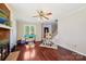 View of the living room with a fireplace, hardwood floors, and a staircase leading to other parts of the home at 207 Crossing Ave, Belmont, NC 28012