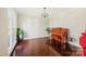Formal living room area with hardwood flooring, piano, and an abundance of natural light at 207 Crossing Ave, Belmont, NC 28012