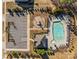 Aerial view of the community pool, clubhouse, playground, and ample parking surrounded by lush trees at 3181 Helmsley Ct, Concord, NC 28027