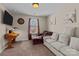 Comfortable, carpeted sitting room with updated lighting and neutral colors at 3181 Helmsley Ct, Concord, NC 28027