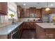 Kitchen featuring stainless steel appliances, granite countertops, and a view of the backyard at 3181 Helmsley Ct, Concord, NC 28027