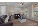 Inviting living room featuring plush sofas, decorative pillows, and natural light at 3181 Helmsley Ct, Concord, NC 28027