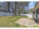 Fenced backyard with green grass and concrete patio at 3701 Teaberry Ct, Charlotte, NC 28227