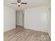Spacious, bright bedroom with ceiling fan and wood-look flooring at 3701 Teaberry Ct, Charlotte, NC 28227