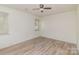 Vacant bedroom with ceiling fan and two windows providing natural light at 3701 Teaberry Ct, Charlotte, NC 28227