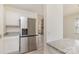 Modern kitchen with stainless steel refrigerator, granite countertop and an open floor plan at 3701 Teaberry Ct, Charlotte, NC 28227