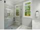 Bathroom featuring a glass shower with marble tile and a built-in bench at 409 Henry Chapel Rd, Belmont, NC 28012