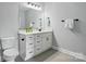 Bathroom featuring a white vanity with drawers, a large mirror, and tiled floors for a clean, modern look at 409 Henry Chapel Rd, Belmont, NC 28012