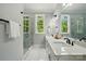 Bathroom with double vanity, marble countertops, and a glass-enclosed shower at 409 Henry Chapel Rd, Belmont, NC 28012