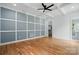 Bedroom with hardwood floors, coffered ceiling, and a grid wall paneling design at 409 Henry Chapel Rd, Belmont, NC 28012