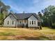 Charming single-Gathering home featuring a classic design, manicured lawn, and inviting front porch at 409 Henry Chapel Rd, Belmont, NC 28012