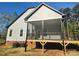 The backyard boasts a cozy screened porch with ceiling fan, offering a relaxing retreat at 409 Henry Chapel Rd, Belmont, NC 28012