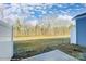 View of the backyard featuring a grassy yard and wooded area at 4211 Black Ct # 193, Harrisburg, NC 28075