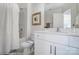 This bathroom features a shower tub combo, vanity, and toilet, with a white color scheme at 4211 Black Ct # 193, Harrisburg, NC 28075