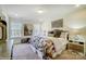 A bedroom offers great natural light, comfortable carpet, and an art wall hanging over the bed at 4211 Black Ct # 193, Harrisburg, NC 28075