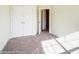 The bedroom has carpeted floors, a closet, and an open doorway leading to another room at 4211 Black Ct # 193, Harrisburg, NC 28075