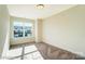 This bedroom has carpeted floors and a large window that lets in lots of natural light at 4211 Black Ct # 193, Harrisburg, NC 28075
