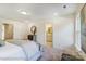 A primary bedroom offers great natural light, carpet, and an ensuite bathroom at 4211 Black Ct # 193, Harrisburg, NC 28075