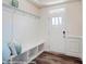 Welcoming entryway with built-in bench, coat hooks, and bright, natural light at 4211 Black Ct # 193, Harrisburg, NC 28075