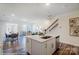 Kitchen with white cabinets, stainless appliances, central island, and open floor plan at 4211 Black Ct # 193, Harrisburg, NC 28075