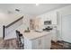 Modern kitchen with white cabinets, quartz countertops, stainless steel appliances, and a kitchen island at 4211 Black Ct # 193, Harrisburg, NC 28075