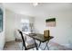 This office has lots of natural light and contains carpeted floors, a painting, and a lamp at 4211 Black Ct # 193, Harrisburg, NC 28075