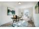 This bright and airy office has a painting and a large window that lets in lots of light at 4211 Black Ct # 193, Harrisburg, NC 28075