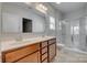 A spacious bathroom features a double sink vanity, a glass-enclosed shower, and neutral decor at 4219 Huntley Glen Dr, Pineville, NC 28134