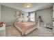 Charming bedroom with unique flower accents and a cozy bed, perfect for a relaxing retreat at 4219 Huntley Glen Dr, Pineville, NC 28134