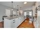Kitchen island offers ample counter space, modern appliances, and a perfect spot for quick meals or entertaining guests at 4219 Huntley Glen Dr, Pineville, NC 28134