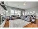 Bright living room features an oversized sectional, contemporary decor, and an inviting space for relaxation and entertainment at 4219 Huntley Glen Dr, Pineville, NC 28134