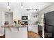 Charming kitchen with white cabinets, granite countertops, and modern appliances at 4921 Park Rd # C, Charlotte, NC 28209