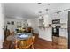 Open-concept living area with a dining table, kitchen, and comfortable seating at 4921 Park Rd # C, Charlotte, NC 28209