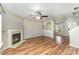 Cozy living room featuring hardwood floors, a fireplace, recessed lighting, and a view of the entryway at 504 Zander Woods Ct, Mount Holly, NC 28120