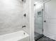 Bathroom features a walk-in shower, rainfall shower head, and sleek black fixtures at 5426 Milford Rd, Charlotte, NC 28210