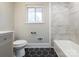 Bathroom features a modern design with black hexagon tile flooring and white subway tile bathtub surround at 5426 Milford Rd, Charlotte, NC 28210