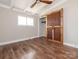 Bedroom with wood floors, ceiling fan and modern, sliding barn door to the closet at 5426 Milford Rd, Charlotte, NC 28210