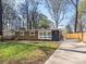 Home exterior featuring a spacious driveway, modern accents and beautifully landscaped front yard at 5426 Milford Rd, Charlotte, NC 28210