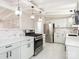 Bright, modern kitchen featuring new stainless steel appliances and stone countertops at 5426 Milford Rd, Charlotte, NC 28210