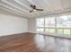 Bright living room featuring hardwood flooring, an exposed beam ceiling and lots of natural light at 5426 Milford Rd, Charlotte, NC 28210