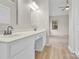 Bathroom with double vanity and sink, mirror, and natural light from window at 5923 Carriage Oaks Dr, Charlotte, NC 28262
