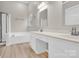 Bathroom features double sink vanity, bathtub and glass shower at 5923 Carriage Oaks Dr, Charlotte, NC 28262