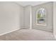 Bedroom with neutral carpet and unique arched window providing natural light at 5923 Carriage Oaks Dr, Charlotte, NC 28262