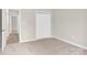 Bedroom with neutral carpet and closet doors at 5923 Carriage Oaks Dr, Charlotte, NC 28262
