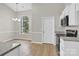Bright kitchen and dining area featuring a large window and stainless steel appliances at 5923 Carriage Oaks Dr, Charlotte, NC 28262