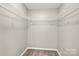 Walk-in closet with built-in shelving for storage at 5923 Carriage Oaks Dr, Charlotte, NC 28262